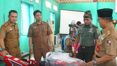 Staf Ahli Bupati Basirun Ali Hadiri Penyerahan Bantuan Alsintan di Lampung Utara